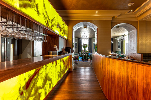 A split view of the amber bar and wooden panelled booths